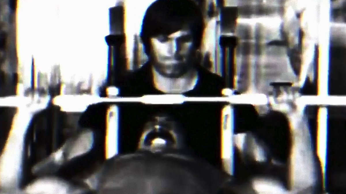 The image shows a man working out at a gym, lifting a barbell above his head while surrounded by exercise equipment. The focus seems to be more on the man than on the background or other people present in the scene. The presence of exercise equipment in the background further supports this notion. It can be inferred that the post is related to fitness and the digital economy, possibly discussing the online fitness industry, various workout routines, or even discussing a specific fitness-related market or business. However, it's not explicitly clear whether the image is directly linked to the fitness post or just an unrelated scene featuring exercise equipment within the same image.