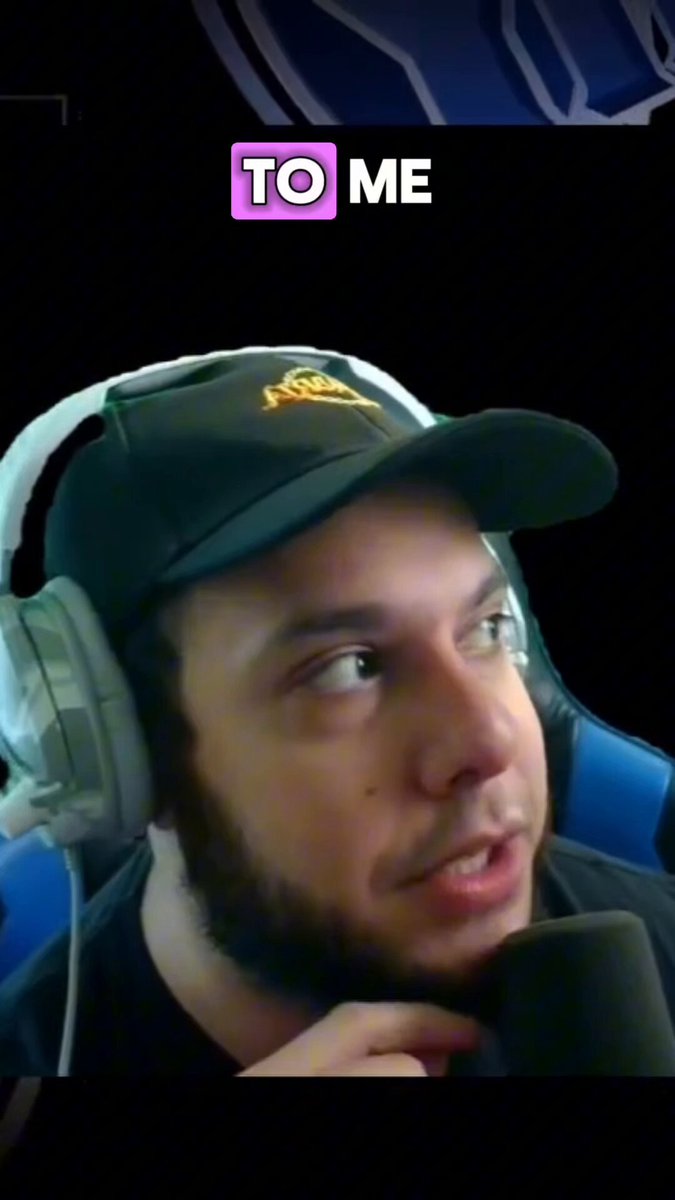The image features a man wearing headphones, possibly listening to music or participating in an online meeting. He has a black hat on his head and appears to be engaged with something off-camera. The caption of the image reads "To Me" which suggests that he is sharing information about himself or someone else who is also present in the frame. This could indicate that they are part of a community, such as a podcast or online event, where people share their experiences and ideas.