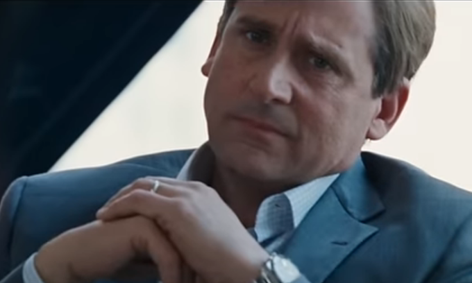 The image shows a man in a dark suit with his hands clasped, wearing a ring and a watch, with a serious or contemplative expression. The emotional close-up likely reflects the bittersweet reality of laid-off Pumpfun employees missing out on substantial PUMP token vesting just two months after losing their jobs.