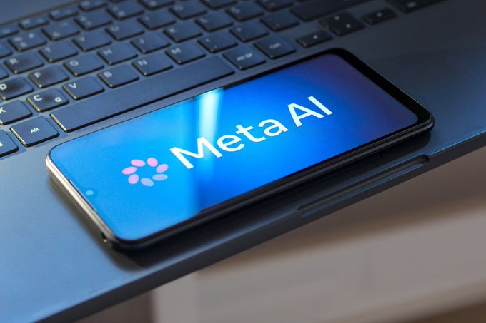 A smartphone displaying the "Meta AI" logo rests on a laptop keyboard, symbolizing Meta's expanding artificial intelligence ambitions. The image visually anchors the report of Meta's reported $10 billion compute leasing deal with Anthropic, highlighting the company's aggressive push to scale its AI infrastructure.