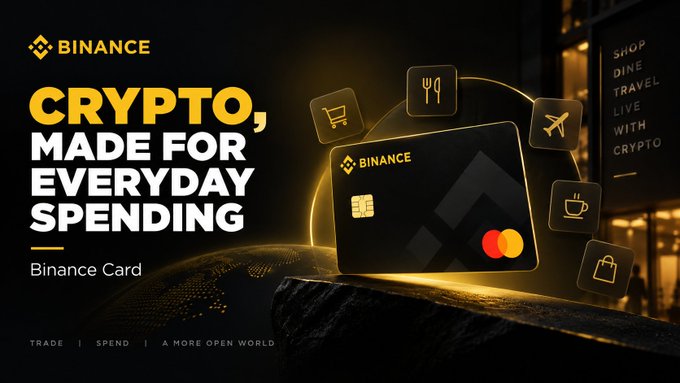 A Binance advertisement featuring the "Binance Card" prominently displayed alongside icons for shopping, dining, travel, and coffee, with the tagline "CRYPTO, MADE FOR EVERYDAY SPENDING" and supporting text "Trade | Spend | A More Open World." The image visually reinforces the post's message about bridging crypto with daily life by showcasing how the card enables real-world purchases, transforming digital assets into practical spending power.