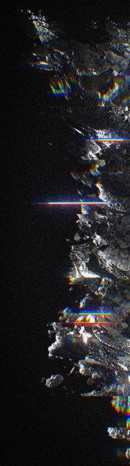 An abstract, glitched, and heavily distorted image with chromatic aberration effects resembling fragmented metallic or asteroid-like textures against a black background.