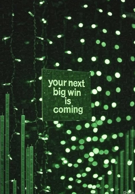 Glowing green string lights and bar-graph silhouettes frame a sign reading "your next big win is coming," visually reinforcing the post's optimistic message of manifesting an upcoming crypto success.