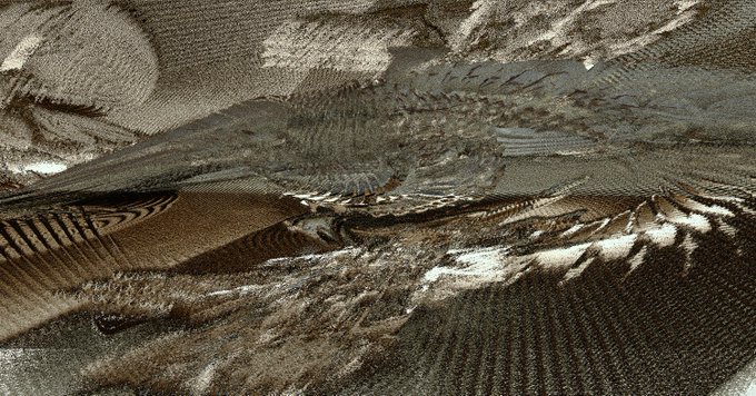 An abstract, sepia-toned image featuring heavily distorted, glitch-like patterns and pixelation artifacts.