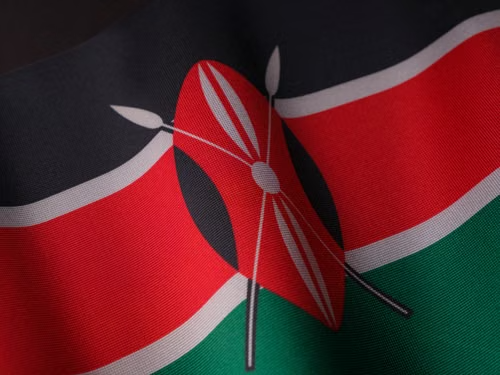 The image shows the Kenyan flag with its iconic Maasai shield and crossed spears design in red, black, and green, symbolizing Kenya's cultural heritage. This relates to the post as Tether signed an MoU with the Nairobi Securities Exchange in Kenya to explore digital assets, tokenization, and blockchain education in Africa.