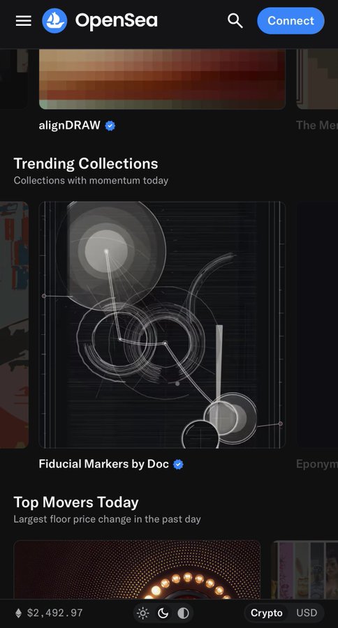 A mobile screenshot of the OpenSea NFT marketplace homepage in dark mode, displaying sections like 'Trending Collections' (featuring 'Fiducial Markers by Doc') and 'Top Movers Today', with an Ethereum price of $2,492.97 shown at the bottom.