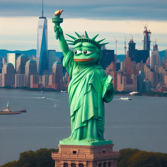 A humorous image of the Statue of Liberty with a Pepe the Frog face, holding a torch with a small bird on it, set against the New York City skyline with One World Trade Center visible.