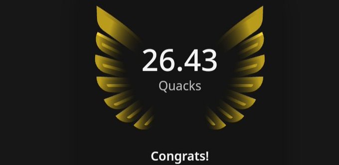 A banner with a gold emblem of an eagle's wings labeled 26.43 Quacks congratulates users for reaching 26.43 Quack milestones. It appears as part of a website or social media platform where people can track their Quacking progress, and the website emphasizes trust, accuracy, and user-experience. The post is likely celebrating achievements related to Quacking within the community.