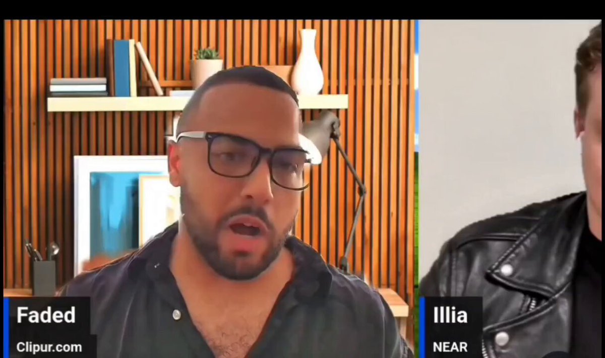 The image shows a man wearing glasses talking to another person who is also wearing glasses. The text at the bottom of the image reads "Faded @illia near", which could be interpreted as an email address or a social media handle. This suggests that the conversation might have been about AI and crypto, given the reference to ChatGPT and Claude.
