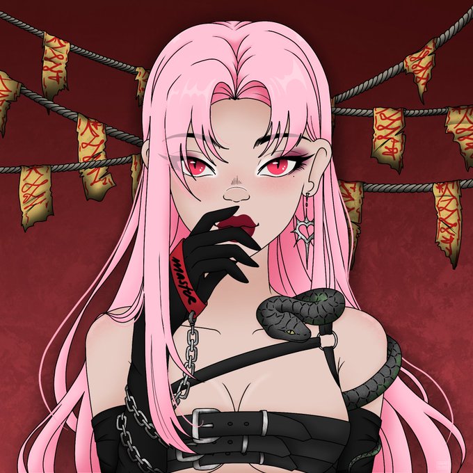 A pink-haired anime character with red eyes poses intensely, wearing a black leather harness, gothic earrings, and a black snake draped over her shoulder, set against a dark red background with talismans strung on ropes. The image ties to the post's mention of a "badass & power couple" collaboration with GoodFellasNFT, showcasing one half of the dynamic duo — "The Master" — alongside her demon companion.