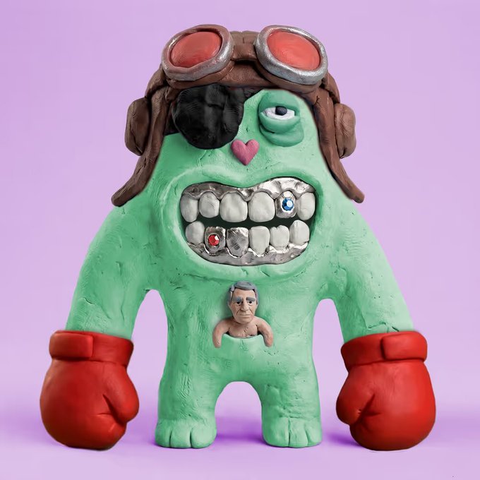 A clay-style sculpted figurine of a green monster wearing an aviator cap with goggles, an eye patch with a heart, exposed teeth with gems, red boxing gloves, and a tiny human figure on its belly, set against a lavender background.