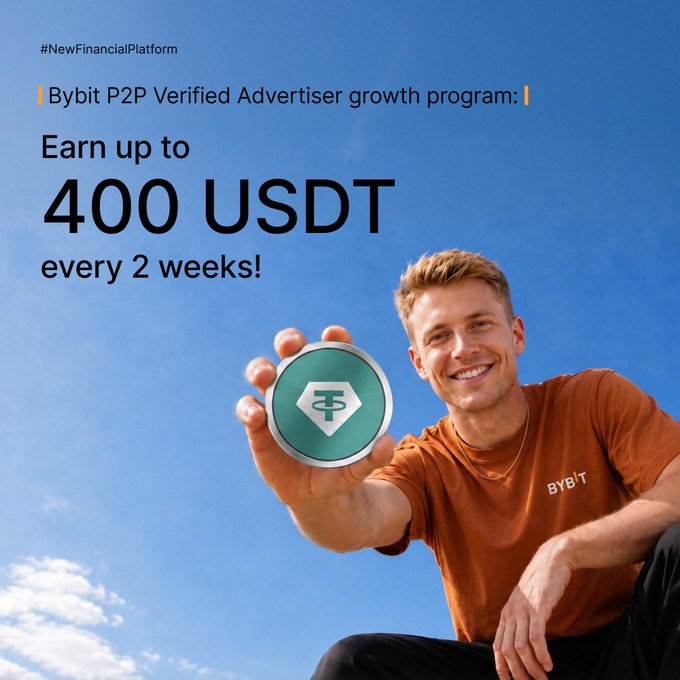 The image features a man sitting down and holding up a coin, which appears to be a green and white token. The background of the image shows a blue sky with clouds. The main focus of the image is the coin held by the man, while the surrounding elements are blurred or out of frame.