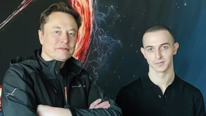 A composite image shows Elon Musk in a SpaceX jacket on the left and another man in a black polo on the right, set against a space-themed background featuring a planet and stars.