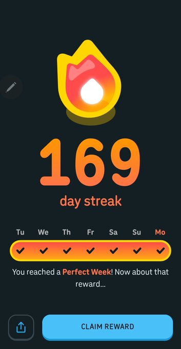 A mobile app screenshot showing a '169 day streak' with a flame icon, checkmarks for a 'Perfect Week!' across the days, and a blue 'CLAIM REWARD' button.