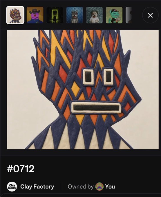 An NFT display showing item #0712 from 'Clay Factory', a stylized geometric character with a spiky orange, red, and yellow crown-like head and rectangular features, owned by the user.
