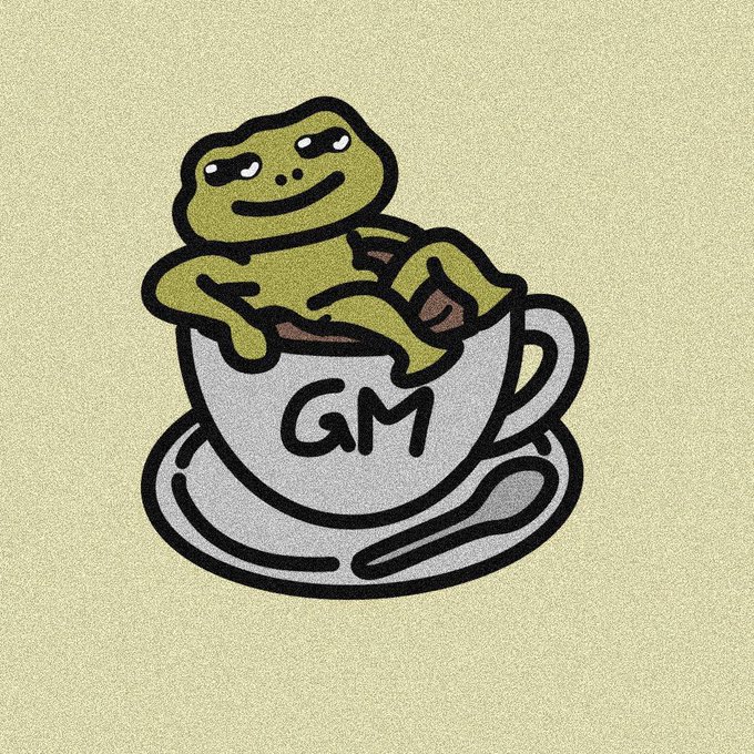 A stylized illustration depicts a green frog sitting comfortably inside a white teacup on a saucer. The cup is labeled with the letters "GM" in bold black text against a pale yellow background.