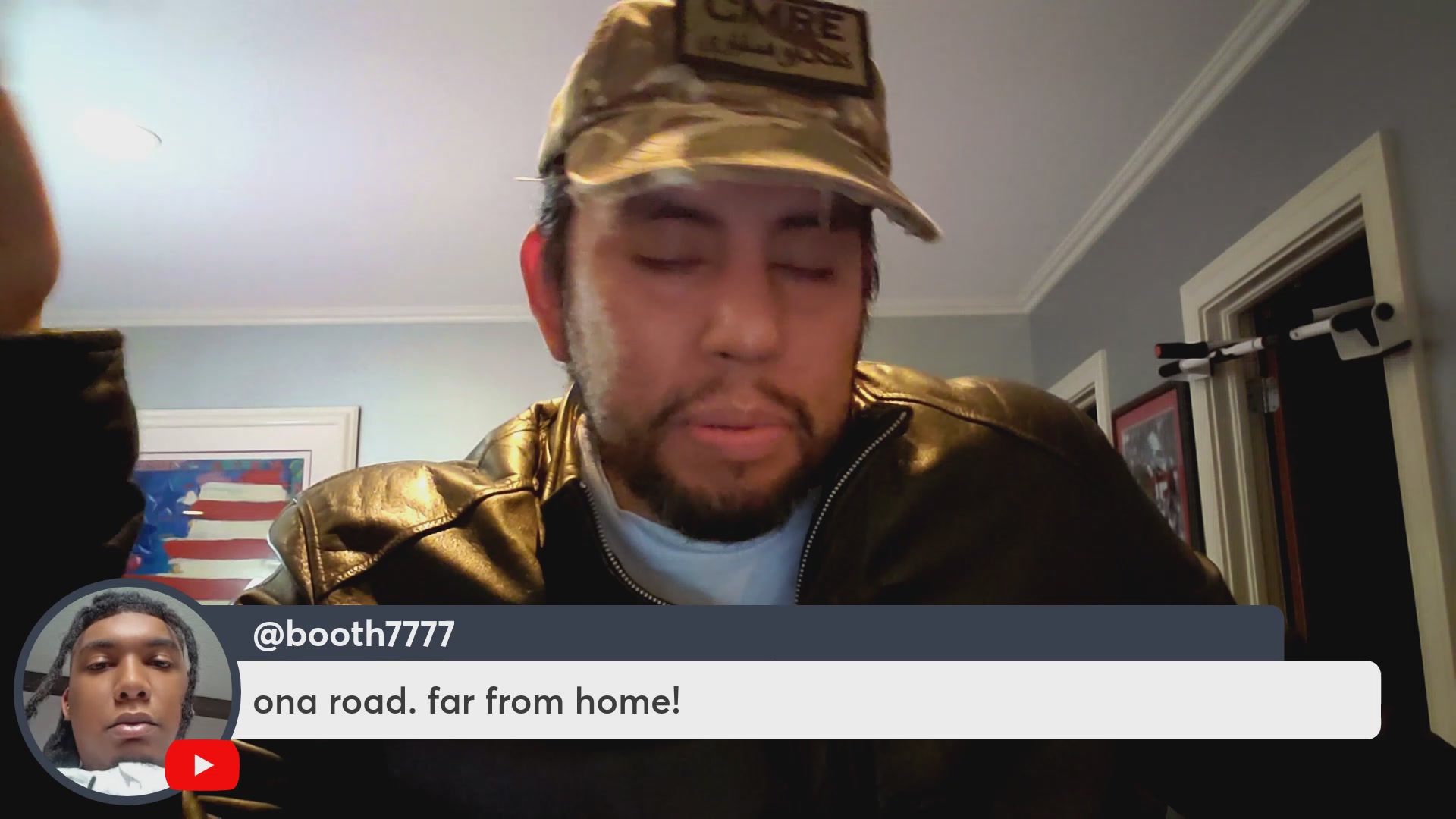 The image is a screenshot of a man wearing a hat, sitting down at a desk with his eyes closed. His name tag says @Bookth77 and he has a beard. The image features several other people and objects, but they do not seem relevant to the main subject - the man in focus wearing the hat and having his eyes closed. A caption related to the post reads "Attention on VeVe collectibles vs $OMI volume! Which will win? $DEFX $DEVVE DACAT news!" The focus of this image is on the man, who appears to be an enthusiast for collectibles or a fan of the TV series Veve.