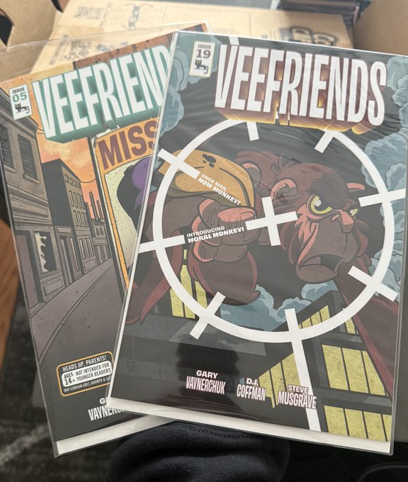 Two VEEFRIENDS comic books (issues 05 and 19) by Gary Vaynerchuk, with issue 19 featuring artwork of a gorilla holding a 'HOW TO WIN MONKEYS!' bag, and names like Gary Vaynerchuk, D.J. Coffman, and Steve Musgrave credited at the bottom.