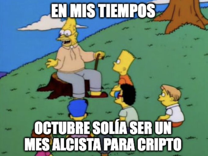 A Spanish-language Simpsons meme showing Grandpa Simpson telling Bart, Milhouse, and other children 'EN MIS TIEMPOS' (In my times) with the caption 'OCTUBRE SOLÍA SER UN MES ALCISTA PARA CRIPTO' (October used to be a bullish month for crypto).