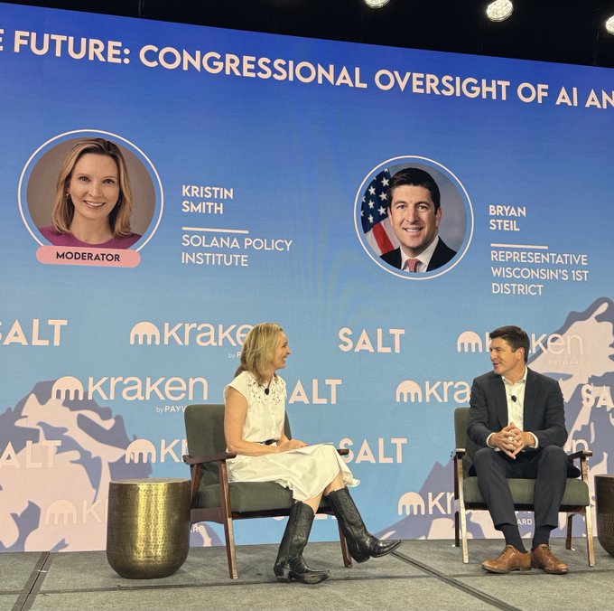 The image shows Kristin Smith of the Solana Policy Institute moderating a panel titled "The Future: Congressional Oversight of AI and..." with Representative Bryan Steil (Wisconsin's 1st District) at a SALT/Kraken conference, complementing the post about Steil making his case for Congressional action on Clarity in digital asset legislation.