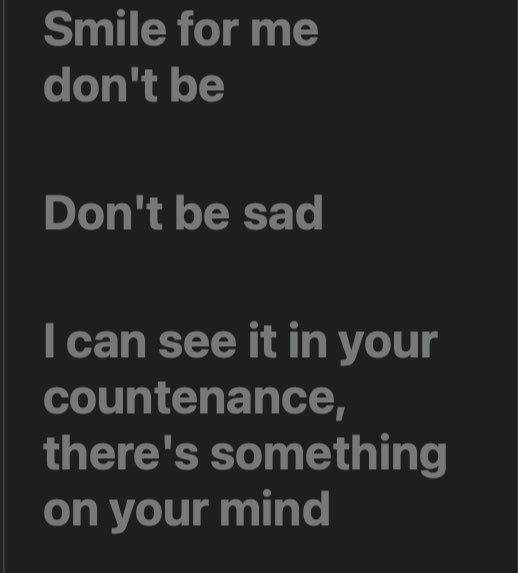 The image displays gray text on a black background that reads: "Smile for me don't be / Don't be sad / I can see it in your countenance, there's something on your mind."

These appear to be lyrics, likely from the song addressed to Ronaldo fans, offering encouragement to smile rather than be sad despite something weighing on their minds.