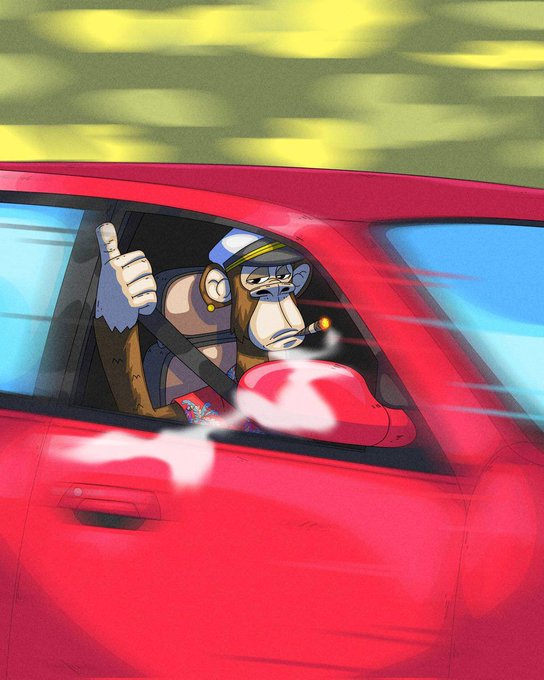 The image features a cartoon monkey driving a red car with its arms outstretched as if giving a thumbs-up sign. The background of the image shows a yellow sky, which contrasts with the red car and adds a pop of color to the scene. The caption reads "Focus on what is in the image and how it relates to the post", indicating that the viewer should pay attention to the details within the image rather than getting distracted by unrelated information.