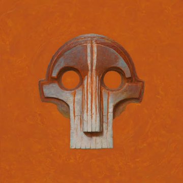 A stylized, symmetrical mask-like sculpture with hollow circular eyes and vertical ridge details is mounted against a vibrant orange wall, resembling an abstract skull or tribal artifact. The piece appears to be one of the art collections mentioned in the post, fitting the theme of artistic curation and collecting.