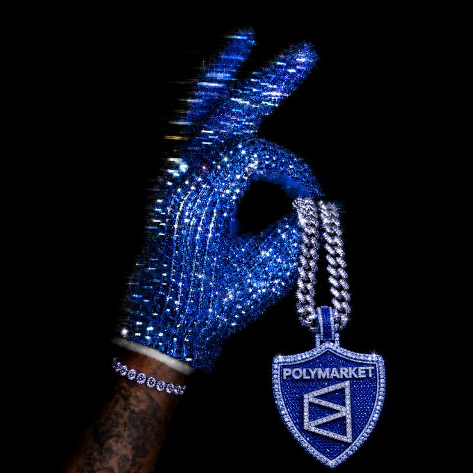 The image features a hand wearing blue gloves with a silver chain attached to them. The hand is holding up a necklace that has a blue shield pendant, which displays the word "POLYMARKET" written on it. There are also some diamonds visible in the scene. The background of the image is black, and there's text present as well.

The post seems to be discussing Polymarket, an online marketplace for rare coins and collectibles. It might be asking about the potential value or significance of the blue shield pendant on the necklace. The hand holding up the necklace could be a symbol representing the owner of the item or someone who is interested in purchasing it.