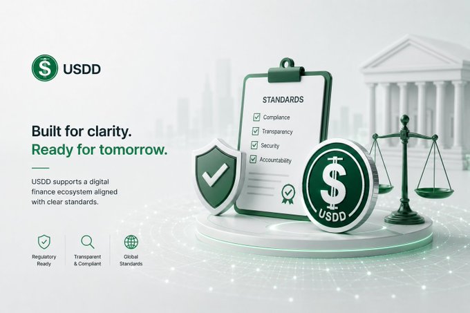 A promotional graphic for 'USDD' cryptocurrency with the text 'Built for clarity. Ready for tomorrow.', showing a clipboard with compliance standards (Compliance, Transparency, Security, Accountability), a shield, scales of justice, and a USDD coin.