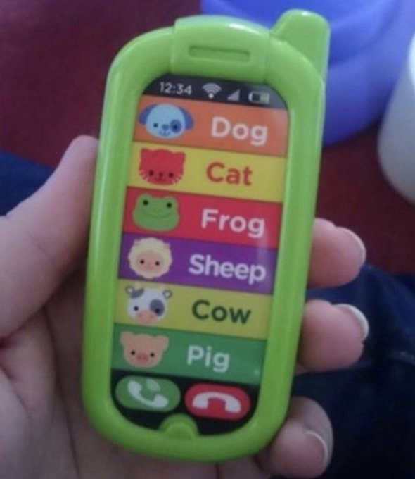 A hand holds a green toy phone displaying a menu with colorful animal icons labeled "Dog," "Cat," "Frog," "Sheep," "Cow," and "Pig" at 12:34, humorously representing a memecoin portfolio where investors hope to pick the right one but often end up with "pig" (a loss) instead of the valuable "cow" or "dog."