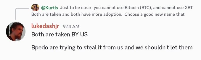 The image shows a Slack chat where user @Kurtis warns that "BTC" and "XBT" cannot be used as Bitcoin ticker names due to existing adoption, to which "lukedashjr" (Luke Dashjr) replies that both are "taken BY US" and that "Bpedo" (likely referring to Bitcoin Core supporters) are trying to steal it from "us." This relates to the post's characterization of Luke Dashjr as wanting his UTXO fork airdrop to be called Bitcoin, as he asserts ownership over the Bitcoin name and ticker against competing factions.