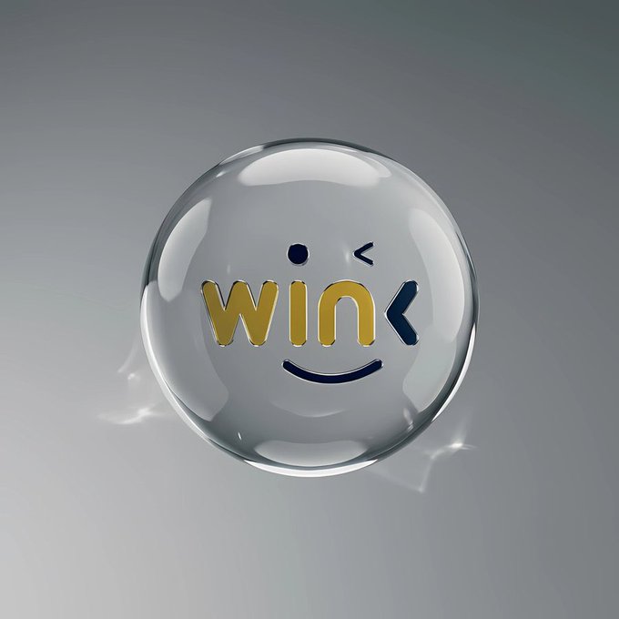 A glossy glass sphere displays a cheerful yellow "WINK" logo styled as a winking smiley face, representing the playful branding of WINkLINK as described in the post about the platform's role in powering Web3's data infrastructure.