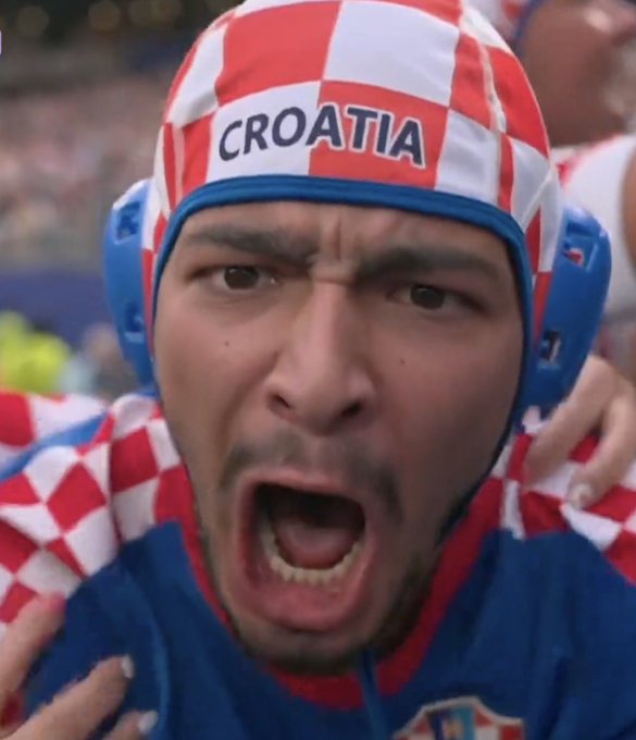 A passionate Croatian fan wearing a red-and-white checkered "CROATIA" swim cap screams in excitement, capturing the emotional intensity of the country's late winning moment that secured a massive $436,590 payout on Stake.