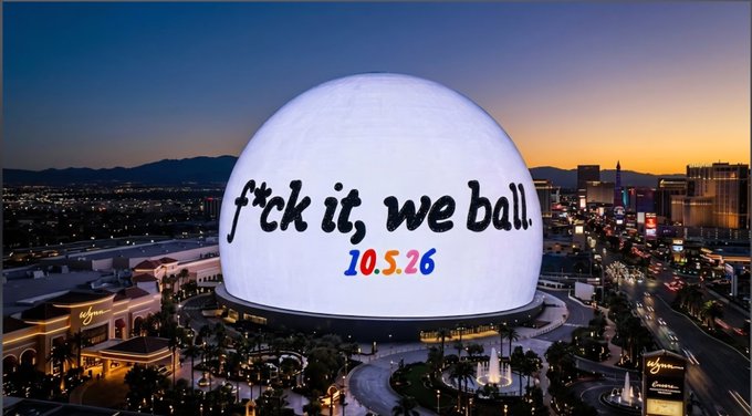 The image displays The Sphere in Las Vegas illuminated against a dusk sky, with its exterior boldly featuring the phrase "f*ck it, we ball." along with the date "10.5.26" projected in colorful lettering. This visually captures the post's accompanying message, using the iconic venue as a backdrop to promote the "f*ck it, we ball" event scheduled for October 5, 2026.