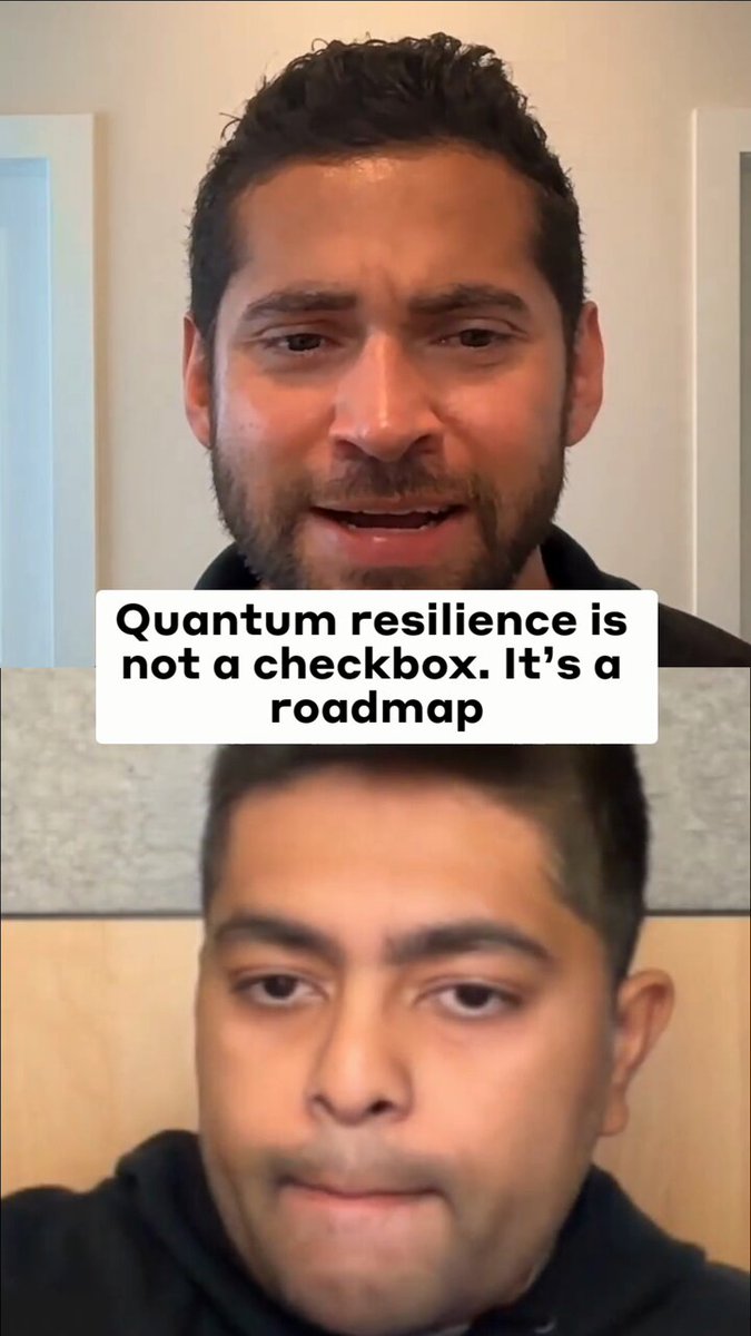 The image shows two men with beards, both wearing black hoodies, standing against a gray wall. The man on the left side of the image has his face partially obscured by another man's beard. They appear to be engaged in a conversation or discussion about Quantum resilience and its implications for the future.