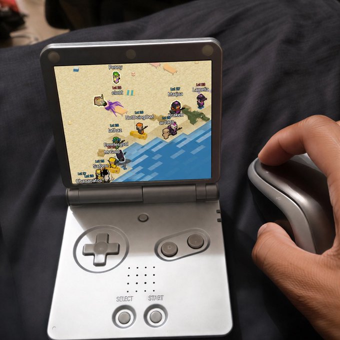 A handheld gaming console displaying a multiplayer game with player avatars on a beach, while a hand operates a wireless mouse nearby.