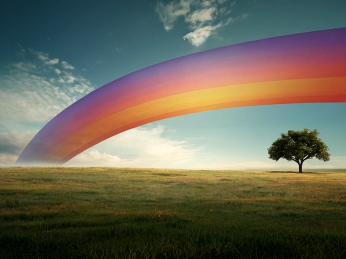 A surreal landscape featuring a vibrant rainbow arching across a blue sky over a grassy field, with a solitary green tree standing on the right side.