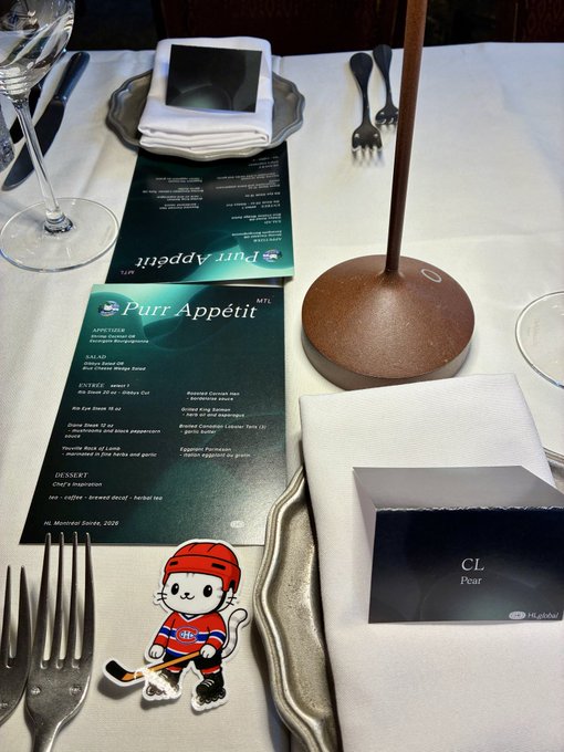 An elegant table setting featuring a "Purr Appétit" menu from Mt. Kisco dated 2026, alongside fine dining accessories including a wine glass, silver cutlery, and a "CL Pear" branded napkin holder, with a charming cartoon hockey cat sticker placed on the white tablecloth—tied to the Hyperliquid event through the "HL Global" watermark.