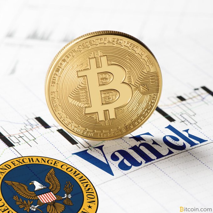 A gold Bitcoin coin displayed on VanEck financial documents with the U.S. Securities and Exchange Commission seal visible in the corner, from Bitcoin.com.