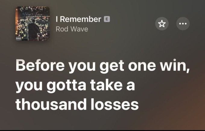 The image features a quote from Rod Wave, which reads "Before you get one win, you gotta take a thousand losses." This quote is related to the current state of Bitcoin, as it has been fluctuating rapidly over time. The image also includes a photo of a person holding a sign that says "There's no way crypto ( $BTC $ETH $POL $POL ) can stay this low forever". This suggests that the Bitcoin market might be experiencing a downturn or a period of instability.