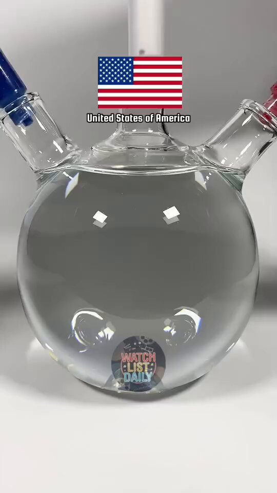 The image features a glass ball with an American flag sticker on top, placed against a white background. The text "United States of America" can be seen on the flag sticker.