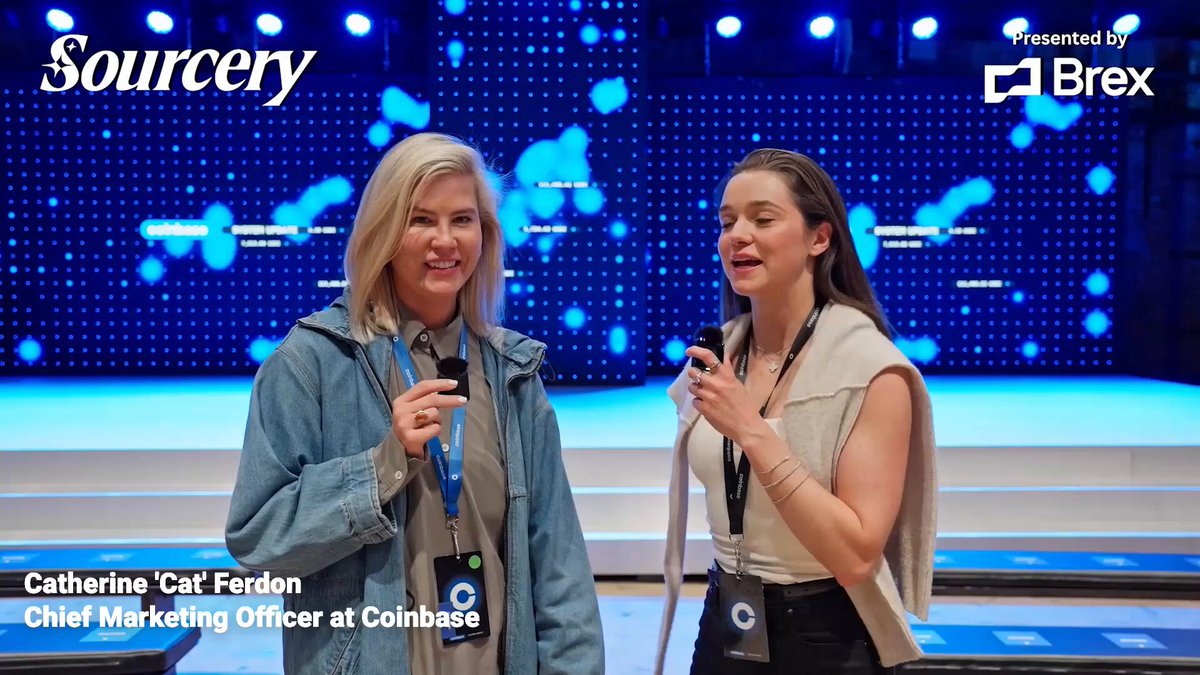 The image features two women standing side by side against a blue background with white text. One woman has blonde hair and is wearing a denim jacket, while the other woman has brown hair and is wearing a black shirt. They are both smiling at the camera, and there's an article about them in the background that reads "EXCLUSIVE: Cat Ferdon ( @catferdon ) CMO of Coinbase". The text also mentions that they want to onboard the next 4 billion users, which implies that their company is focused on expanding its reach to a larger audience.