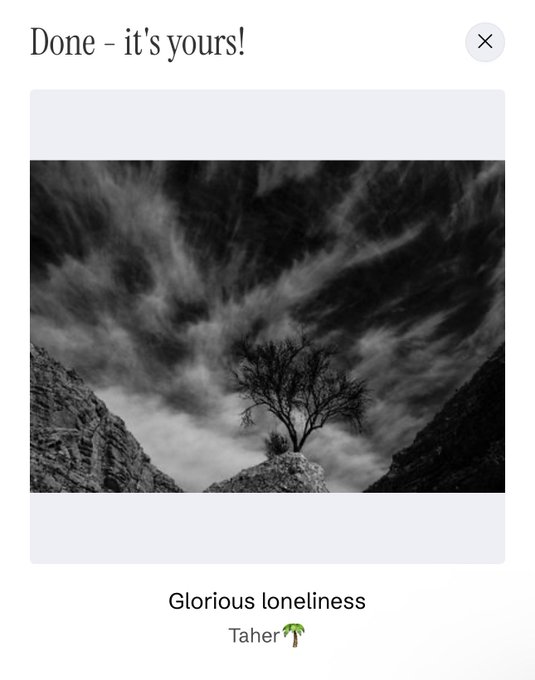 A black and white photograph titled "Glorious loneliness" by Taher, showing a lone tree on a rocky outcrop beneath dramatic, sweeping clouds. The artwork has been claimed on objkt.com, with the notification "Done - it's yours!" confirming successful collection of the NFT.