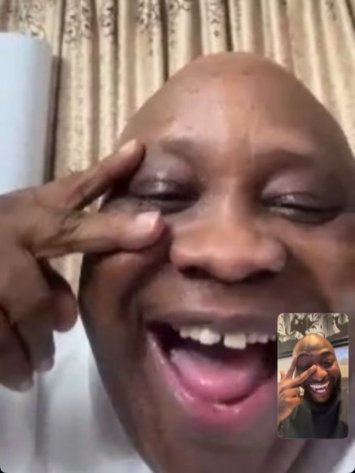 A close-up selfie shows a bald man laughing heartily with tears in his eyes and a finger near his face, with a smaller picture-in-picture showing the same moment.