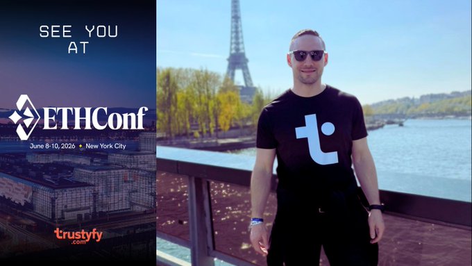 The image features a man wearing sunglasses posing for a photo next to a bridge over water with a tower in the background. The text "See you at @ETHConf New York City" is displayed above him, indicating that he is attending an event related to cryptocurrency or blockchain technology. The post also mentions that Trustyfy will be present and that they are interested in meeting someone named Payden.