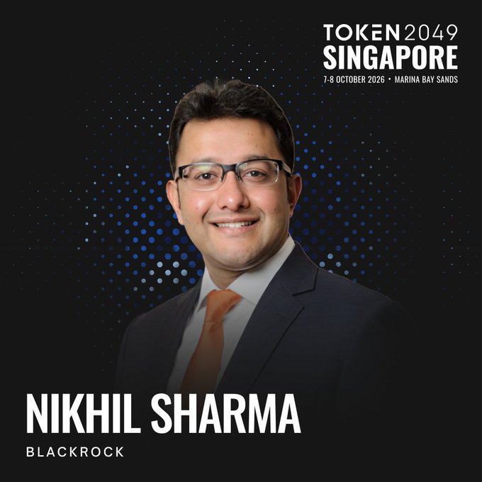 Promotional graphic for TOKEN2049 Singapore (7-8 October 2026 at Marina Bay Sands) featuring a headshot of Nikhil Sharma of BlackRock, displayed against a dark background with blue dotted accents. The image aligns with the post announcing his appearance as a speaker representing BlackRock's Digital Assets division at the conference.