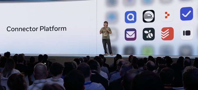 A man presents on stage at a tech event with a large screen behind him reading "Connector Platform" alongside various app icons including Todoist, Trello, and Asana.