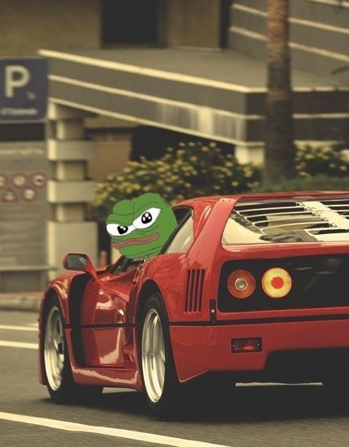 A humorous edited image showing Pepe the Frog meme character behind the wheel of a red sports car in an urban parking area.