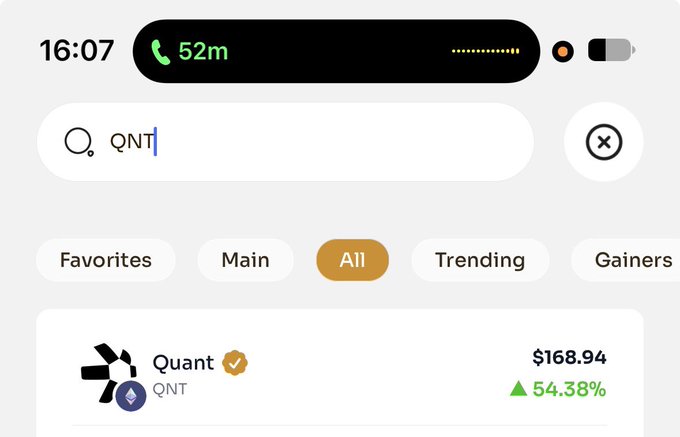 A mobile app screenshot showing a search for 'QNT' (Quant) with the token priced at $168.94, up 54.38%, with a phone call notification showing 52 minutes at the top.
