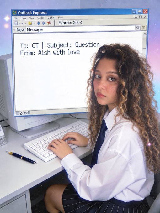 A young woman with curly hair in a white shirt and tie sits at a desk with a keyboard and pen; the computer screen shows an Outlook Express email with the message "To: CT | Subject: Question From: Aish with love" against a sparkly purple background.